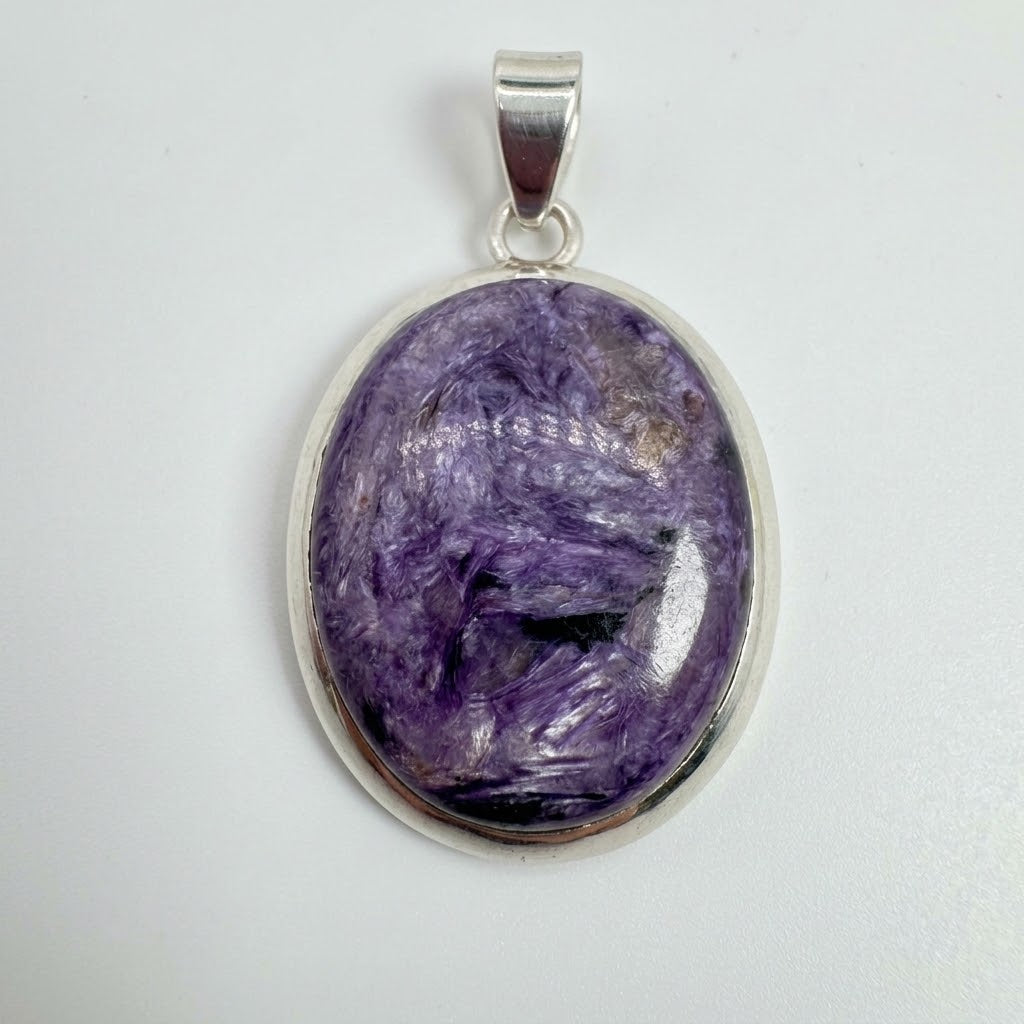 Colgante de charoita natural en plata de ley